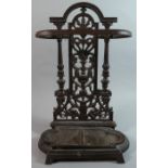 A Small Cast Iron Stick Stand with Removable Drip Tray and Pierced Foliate Decoration, 50cm high