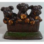 A Cast Iron Novelty Doorstop in the Form of Three Bull Dog Pups Peering Over Wall, 18cm Wide