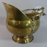 A Modern Ceramic Handled Brass Helmet Shaped Coal Scuttle