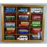 A Glazed Wooden Display Containing 15 Diecast Models of Vintage Buses