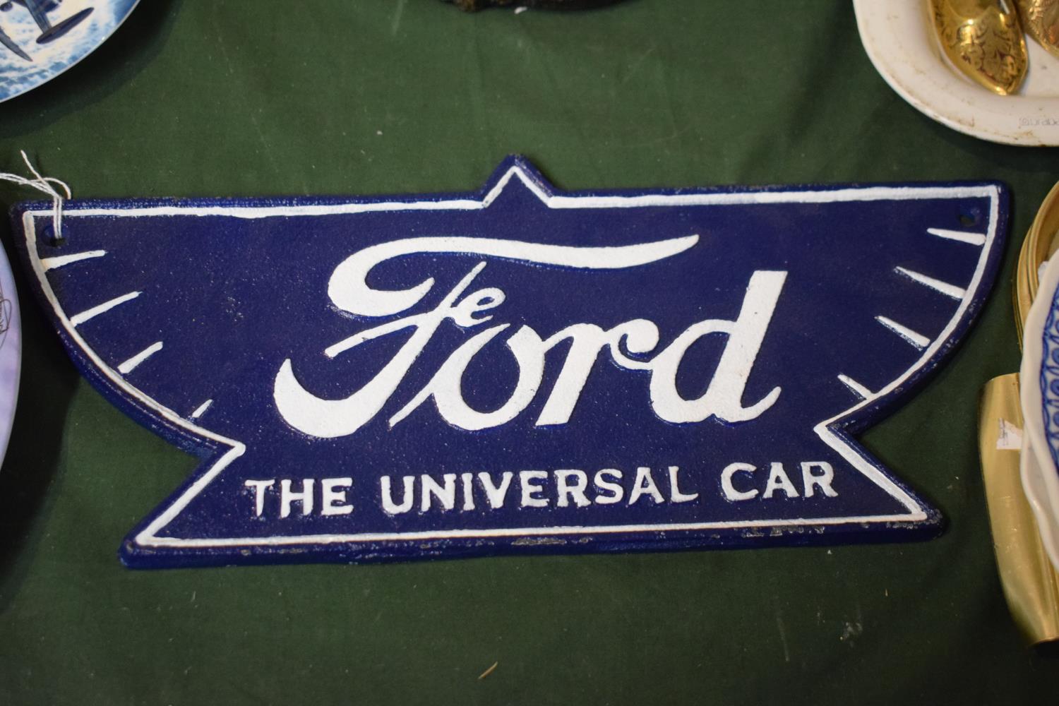 A Reproduction Cast Metal Ford Plaque, The Universal Car, 36.5cm Wide plus Vat