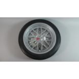 A Modern Novelty Wall Clock in the Form of a Sports Car Alloy Wheel and Tyre, 35cm Diameter