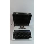 A Vintage Silver Reed SR 100 Tabulator Manual Typewriter in Carrying Case