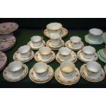 A Collection of Edwardian Rose Pattern Teawares Comprising Ten Trios, Slop Bowl, Saucers, Cream Jug,