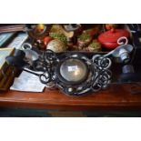 A Set of Three Wrought Iron Mirrored Two Branch Wall Lights