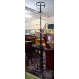 A Brass Mounted Wrought Iron Adjustable Rise and Fall Oil Lamp Stand on Tripod Support