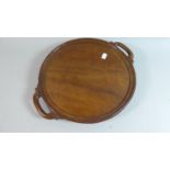 A Circular Mahogany Wall Hanging Two Handled Tray, 36cm Diameter