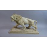 A Large Marble Effect Resin Study of a Lion on Rectangular Plinth, 35.5cm Wide