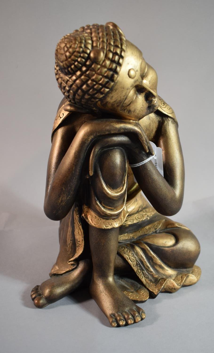 A Gilded Resin Study of Seated Thai Buddha Resting Head and with Eyes Closed, 28.5cm High