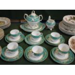 A Late 19th/Early 20th Century Tea Set Comprising Six Trios, Cream and Lidded Sugar Bowl, Cake Plate