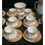 A Collection of Edwardian Rose Pattern Teawares Comprising Six Trios, Cream and Sugar