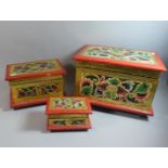 A Graduated Set of Three Painted Wooden Boxes with Relief Floral Decoration, the Largest 38cm Wide