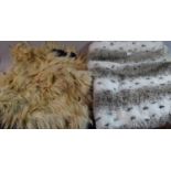 A Sheepskin Rug and a Faux Fur Throw