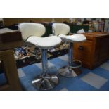 A Pair of Chrome Based Vintage Style Adjustable Swivel Bar Stools