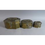 A Set of Three Graduated Brass Boxes with Pierced Decoration and Carrying Handles
