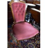 A Late Victorian Inlaid Walnut Framed Nursing Chair with Buttoned Upholstered Back and Serpentine