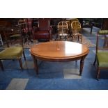 An Inlaid Oval Inlaid Simon Simpson Coffee Table on Turned Supports, 110cm Long