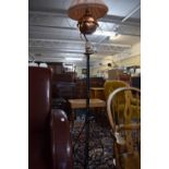A Wrought Iron Based Tripod Lamp Stand with Upper Copper Lamp Holder and Oil Lamp Converted to