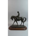 An Irish Resin Study of a Racehorse with Jockey, Ear AF, Oval Wooden Plinth, 33cm Wide