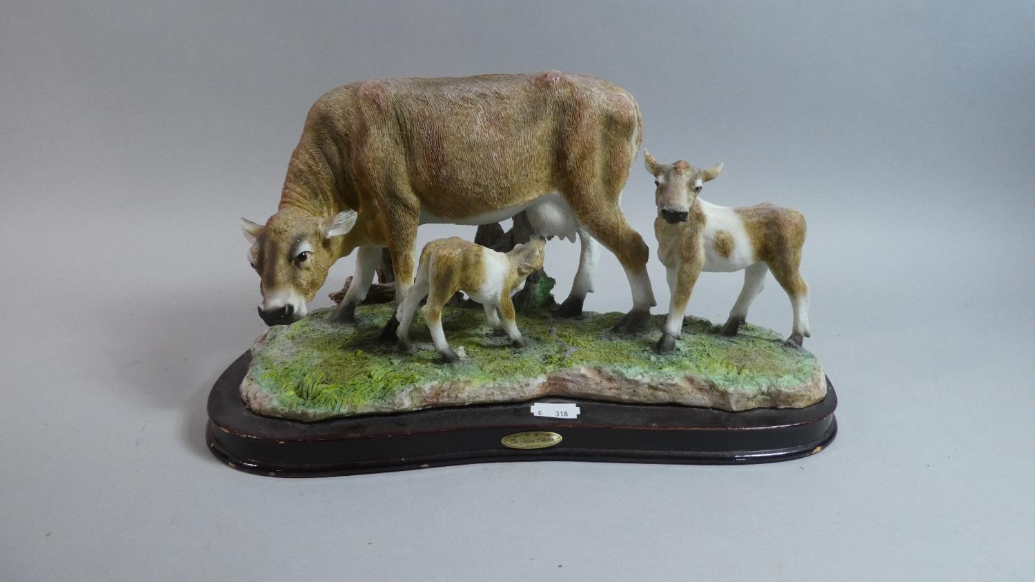 A Juliana Study of Cow and Two Calves on Wooden Plinth, 33cm Long