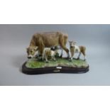 A Juliana Study of Cow and Two Calves on Wooden Plinth, 33cm Long