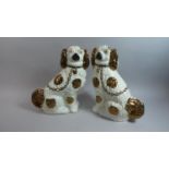 A Pair of Copper Lustre Decorated Staffordshire Spaniels each 31cm high