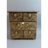 A Carved Indian Wooden Spice Chest with Gilt Decoration of Four Short and One Long Drawers, 30cm