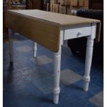 A Limed Top Painted Base Drop Leaf Kitchen Table with Single Drawer, 122cm wide