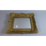 A Gilt Framed Wall Hanging Mirror with Moulded Decoration, 31cm x 27cm