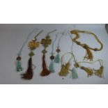 A Collection of Oriental Pierced Jadeite Pendants, Tassels etc