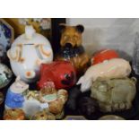 A Collection of Ceramic Pig Money Boxes, Butter Dish and Two Resin Ornaments