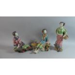 A Set of Three Oriental Glazed Figural Ornaments of Maidens, All Missing one or More Fingers, Seal