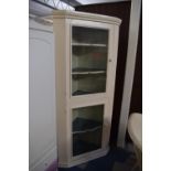 A Cream Painted Double Freestanding Glazed Corner Cabinet with Shaped Shelves, 75cm Wide