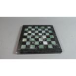 A Greek Marble Miniature Chess Board, 20cm Square