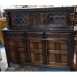 A Mid 20th Century Oak Sideboard with Three Drawers Over Cupboard Base and Raised Glazed Top Section