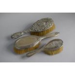 A Collection of Three Silver Mounted Dressing Table Hair Brushes, Birmingham and London Hallmarks