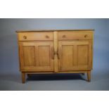 A 1970's Ercol Elm Sideboard with Two Drawers Over Cupboard, 129cm Wide