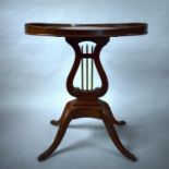 A Reproduction Mahogany Galleried Occasional Table with Lyre Support having Brass Rods. Four