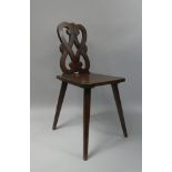 A 19th Century Swedish Fruitwood Side Chair with a Carved and Pierced Back over a Plank Seat