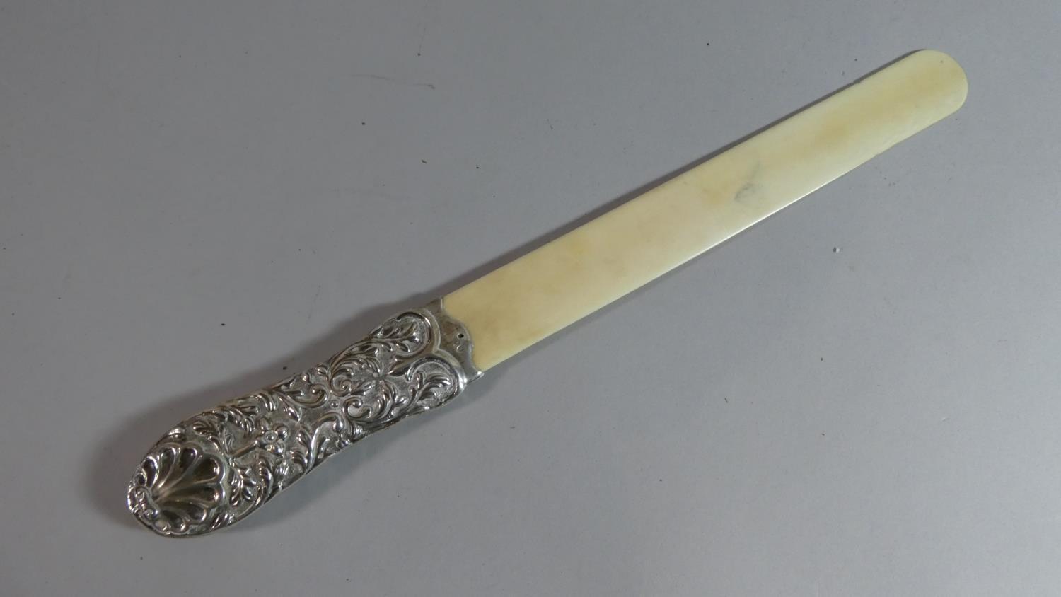 A Late 19th Century Silver Mounted Ivory Bladed Page Turner, Hallmark Rubbed. 40cms Long