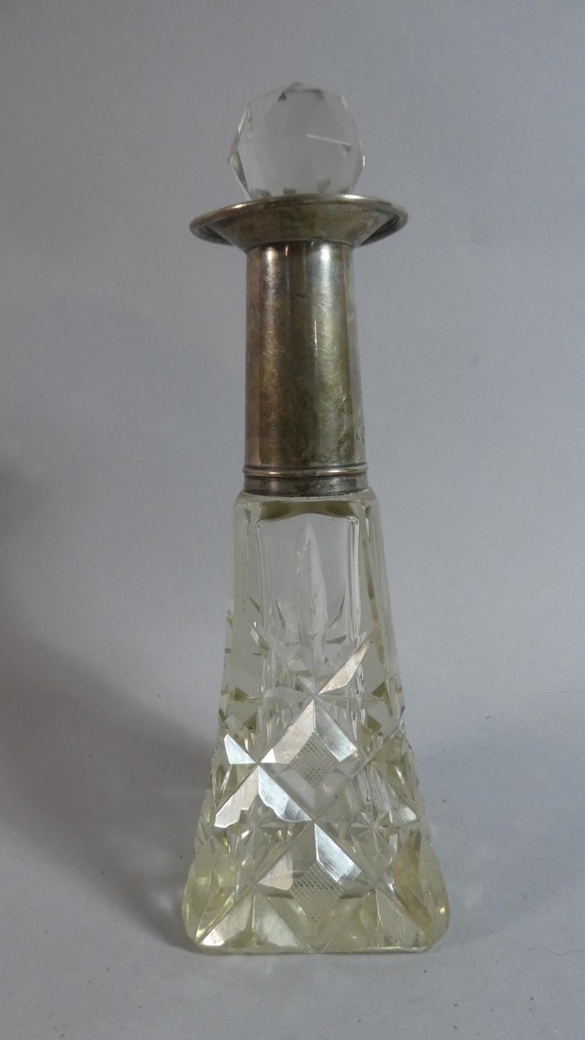 A Silver Mounted Glass Perfume Flask with Stopper. Birmingham 1921. 17cms High