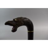 An Oriental 19th Century Walking Stick of Segmented Horn Form with Carved Dragon Head Handle with
