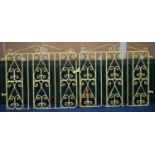 A Pair of Early 20th Century Arts and Crafts Style Iron Gates with Scrolled Decoration. 110x250cms