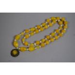 A 20th Century Chinese Lemon Glass Bead and Pearl Necklace, with White Metal Filigree Dropper,