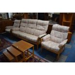 An Ercol Three Piece Suite with Ladder Back and Upholstered Cushions