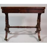A Mid/Late 19th Century Mahogany Lift and Twist Games Table with Claw Feet and Castors. 89cms Wide