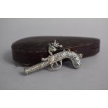 A Cased Novelty Silver Whistle in the Form of a Flintlock Pistol, 6cm Long