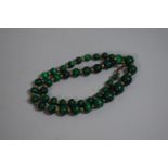 An Early 20th Century Malachite Necklace, Graduated Spherical Beads with Yellow Metal Spacers with
