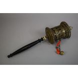 A Tibetan Prayer Wheel with Turned Ebonised Handle, 37cm Long