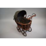 A Small Vintage Style Iron Framed Doll's Toy Pram, 41cm high